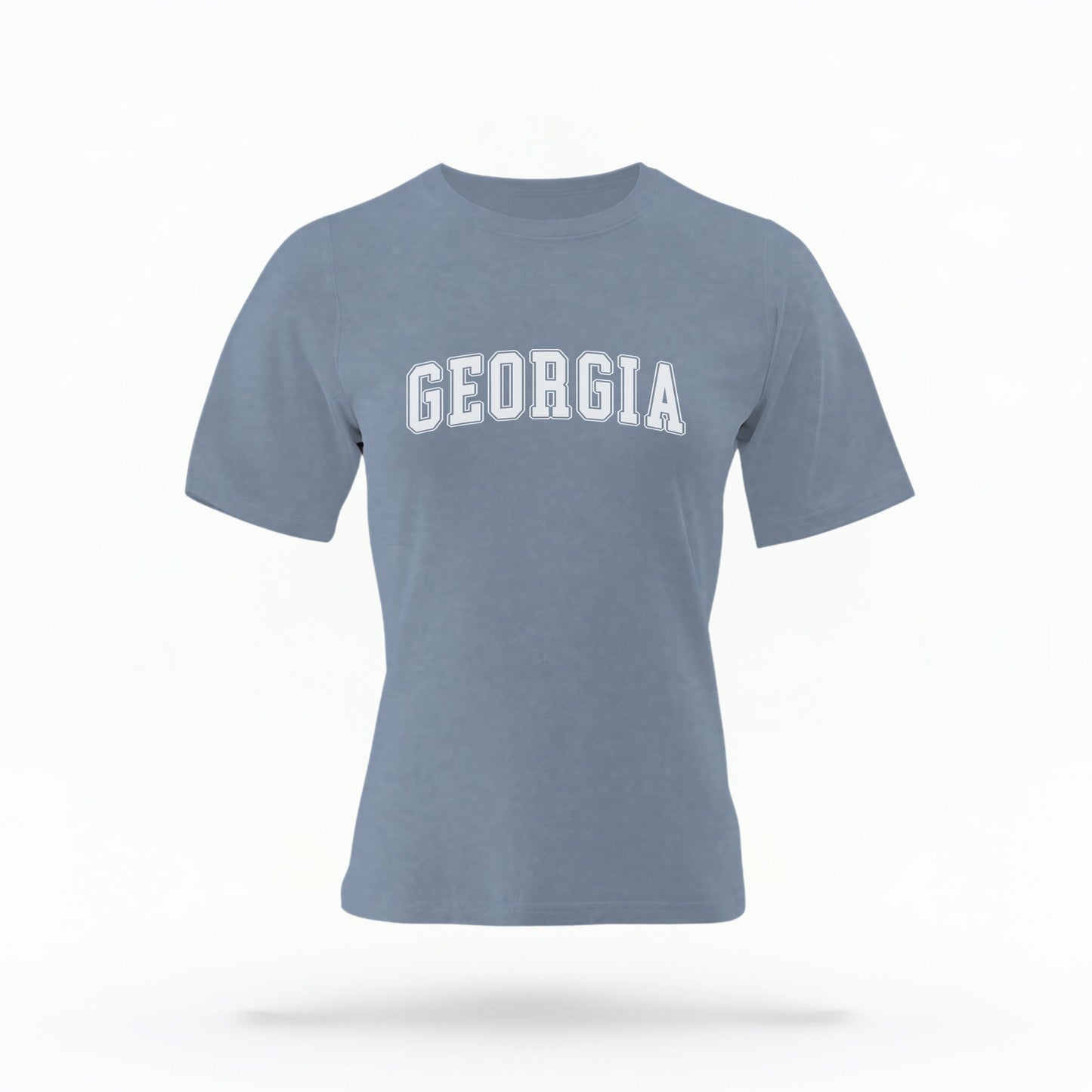 The Blue Jeans Unisex Georgia Varsity Comfort Colors T-shirt lays flat on a white background. The Georgia graphic is in bold white in a varsity offset style.
