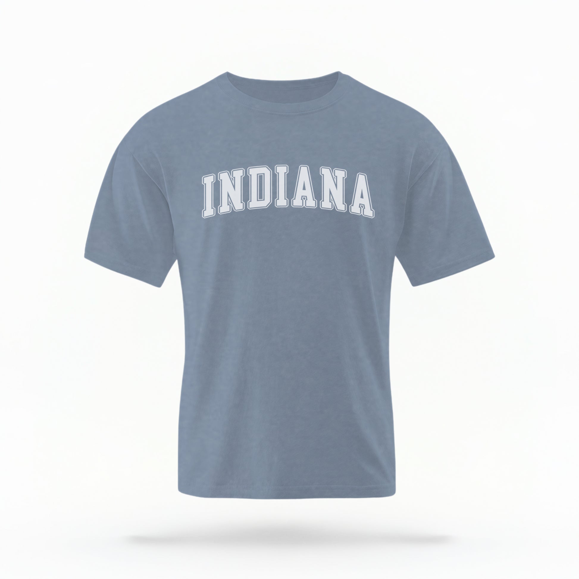 The Blue Jeans Unisex Indiana Varsity Comfort Colors T-shirt lays flat on a white background. The Indiana graphic is in bold white in a varsity offset style.