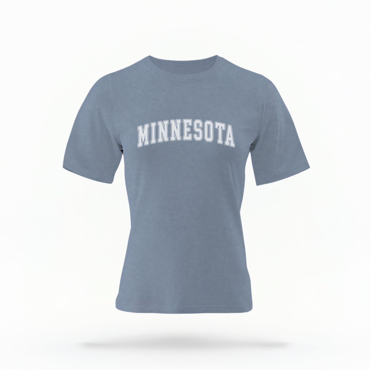 The Blue Jeans Unisex Minnesota Varsity Comfort Colors T-shirt lays flat on a white background. The Minnesota graphic is in bold white in a varsity offset style.
