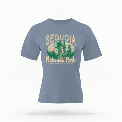 The Blue Jeans Adult Unisex Sequoia National Park Comfort Colors T-shirt lays flat on a white background. The ﻿Sequoia National Park﻿ graphic is in bold cream in a Rustic Park style.