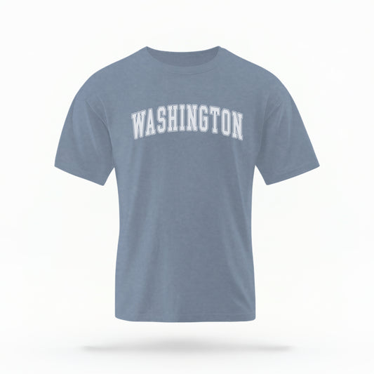 The Crimson Unisex Washington Varsity Comfort Colors T-shirt lays flat on a white background. The Washington graphic is in bold white in a varsity offset style.