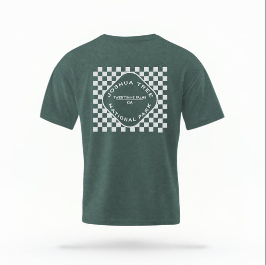 The Blue Spruce Joshua Tree Retro Checkered Comfort Colors T-shirt lays flat on a white background. The ﻿Joshua Tree Retro Checkered﻿ graphic is in bold White in a Retro style.