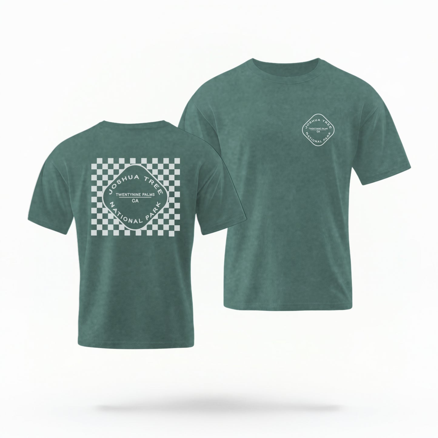 The Blue Spruce Joshua Tree Retro Checkered Comfort Colors T-shirt lays flat on a white background. The ﻿Joshua Tree Retro Checkered﻿ graphic is in bold White in a Retro style.