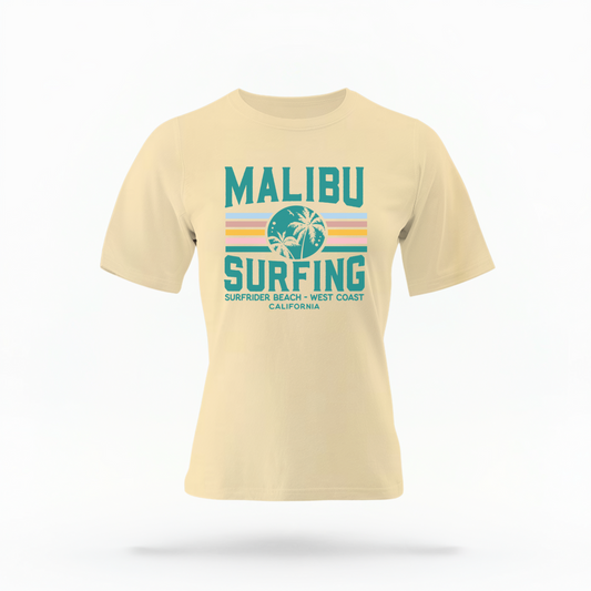 The Butter Adult Unisex Malibu California Surfing Comfort Colors T-shirt lays flat on a white background. The ﻿Malibu California Surfing﻿ graphic is in bold Lifestyle in a Multicolor style.