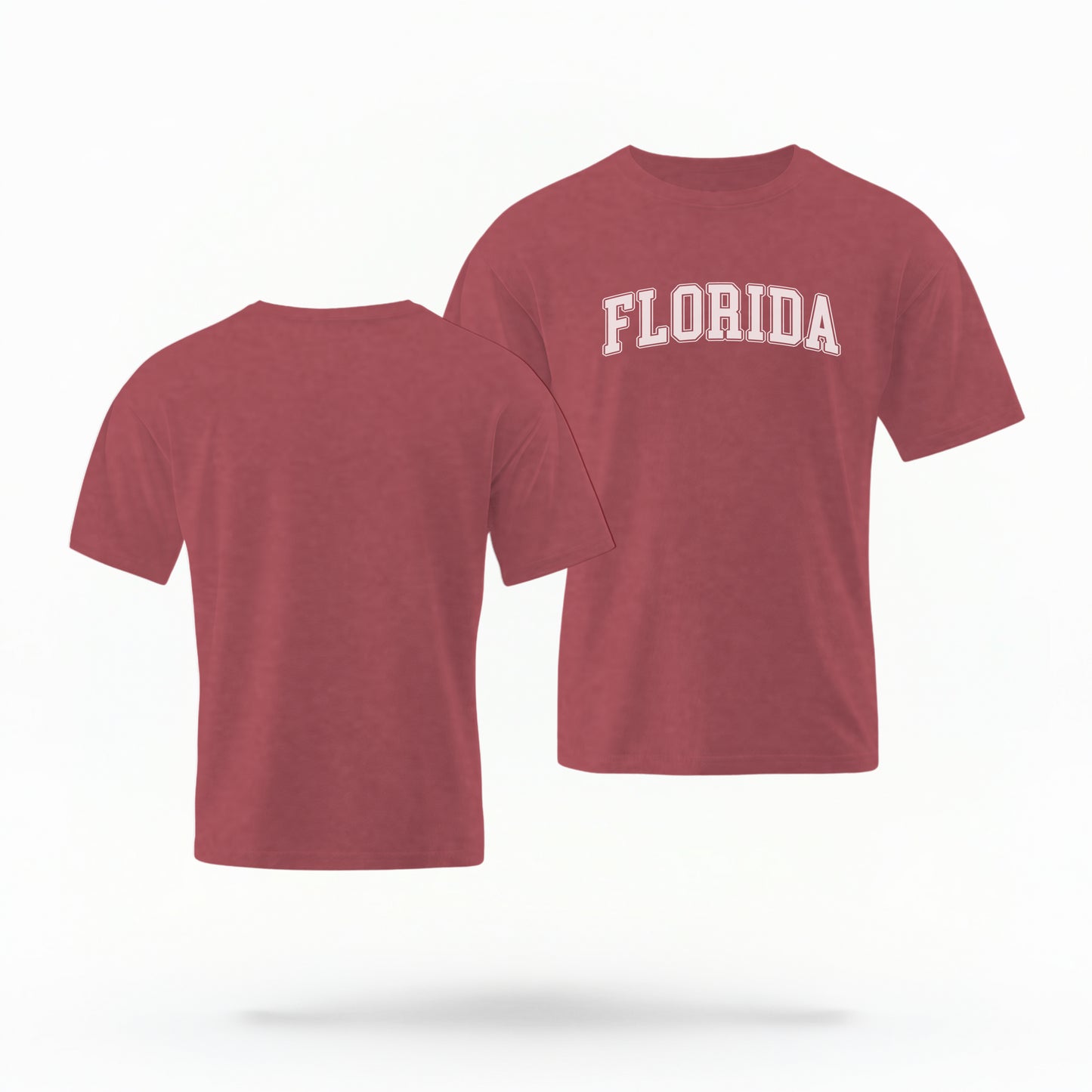 The crimson Adult Unisex Florida Varsity Comfort Colors T-shirt lays flat on a white background. The Florida graphic is in bold white in a varsity offset style.