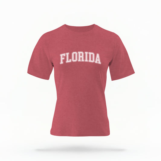 The Crimson Adult Unisex Florida Varsity Comfort Colors T-shirt lays flat on a white background. The Florida graphic is in bold white in a varsity offset style.
