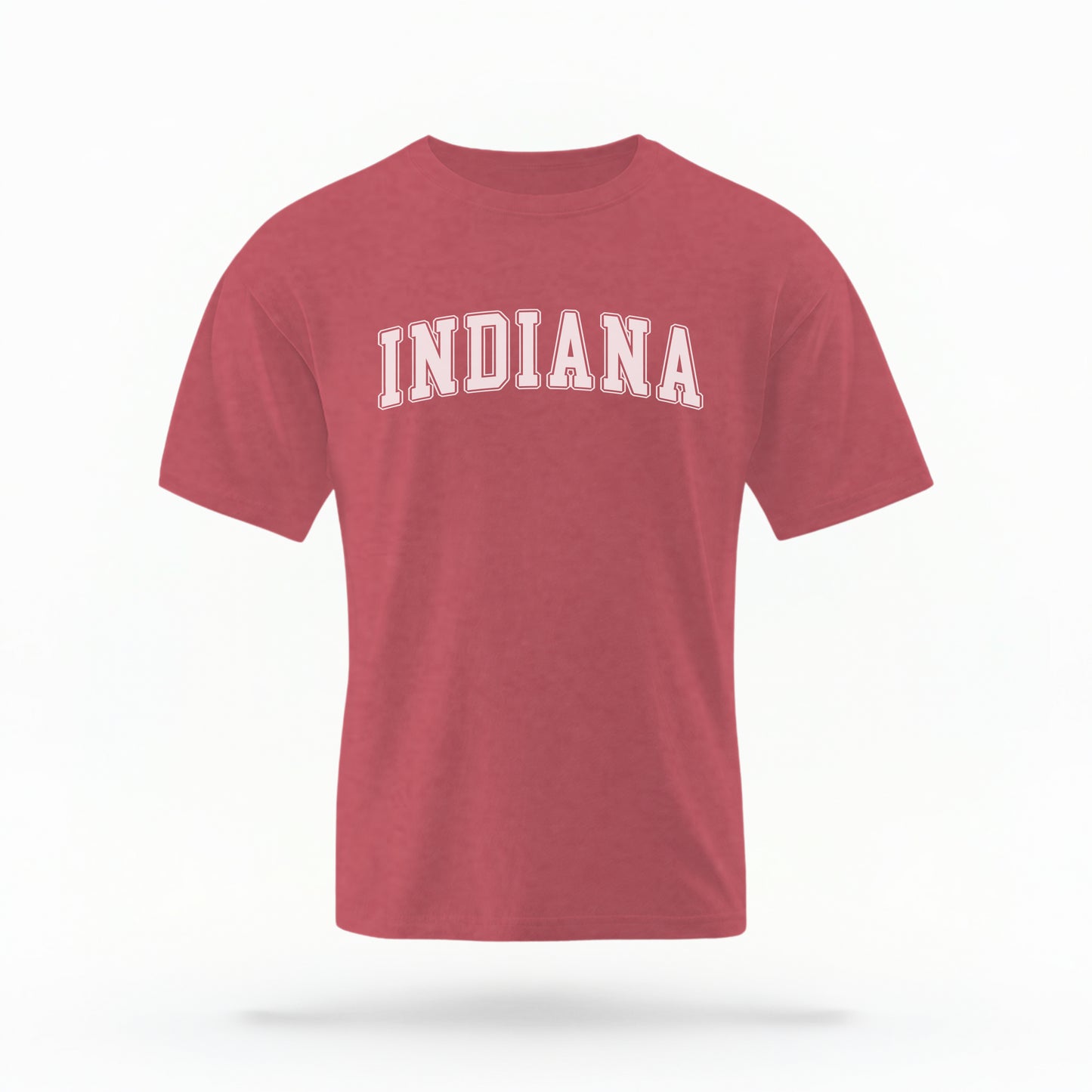 The Crimson Unisex Indiana Varsity Comfort Colors T-shirt lays flat on a white background. The Indiana graphic is in bold white in a varsity offset style.