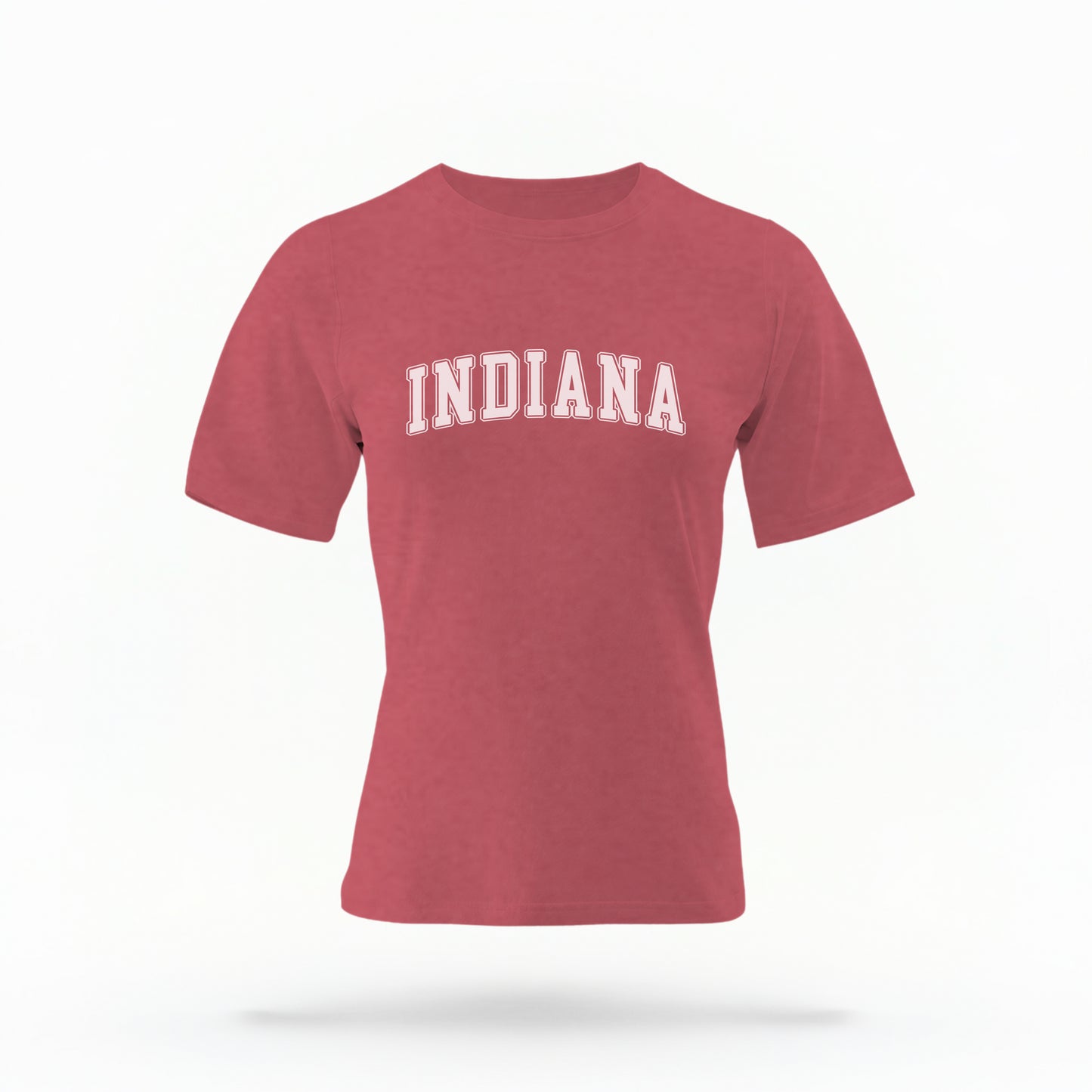 The Crimson Unisex Indiana Varsity Comfort Colors T-shirt lays flat on a white background. The Indiana graphic is in bold white in a varsity offset style.