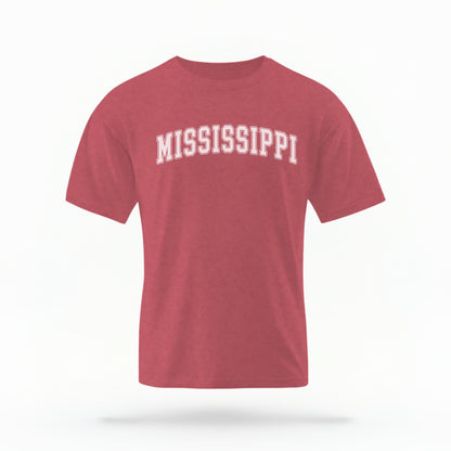 The Crimson Unisex Mississippi Varsity Comfort Colors T-shirt lays flat on a white background. The Mississippi graphic is in bold white in a varsity offset style.