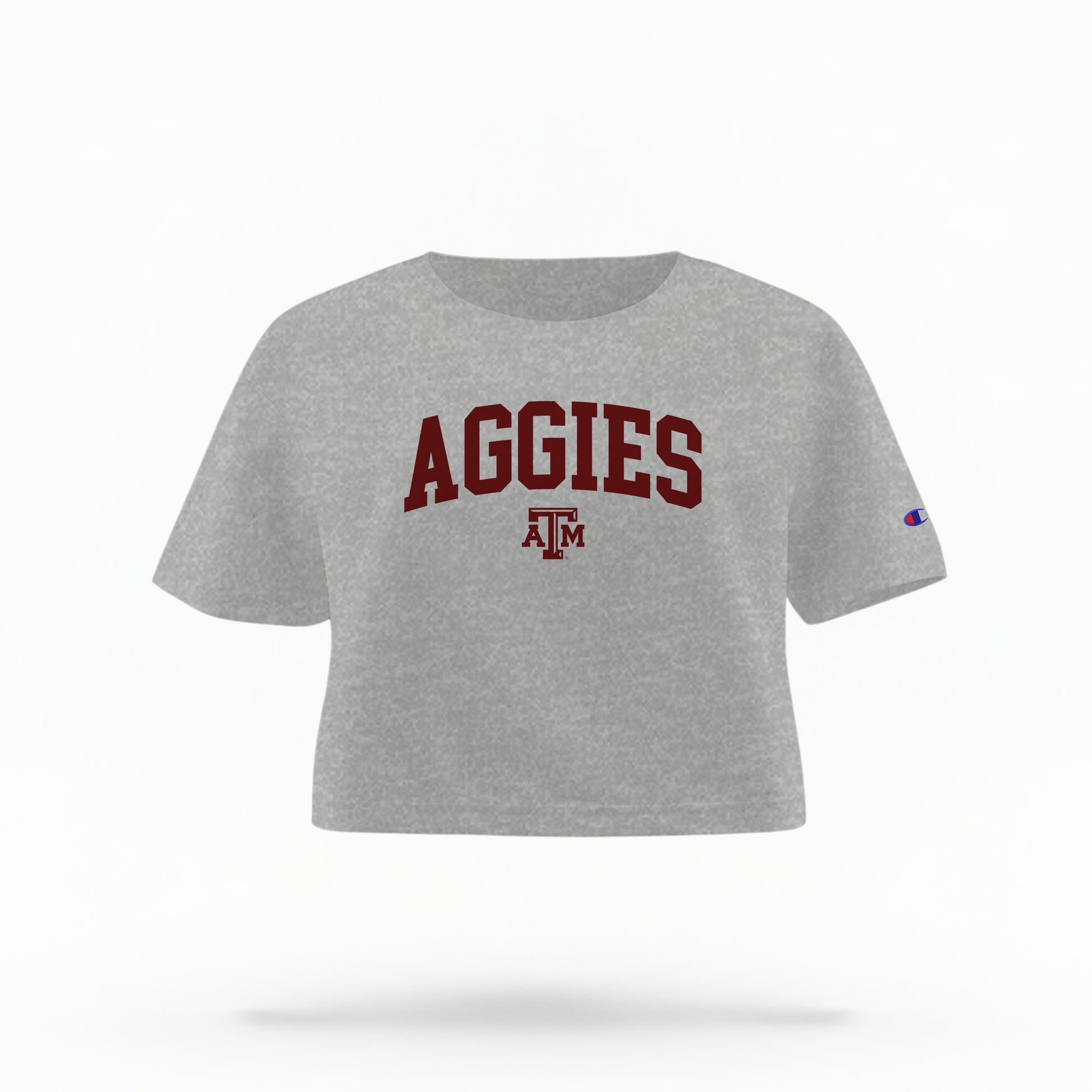 The Oxford Grey Adult Womens Texas A&M Aggies Collegiate Crop Top lays flat on a white background. The ﻿Texas A&M Aggies Collegiate﻿ graphic is in bold Maroon in a Varsity style.