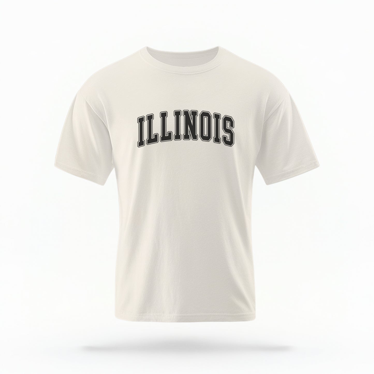 The ivory Unisex Illinois Varsity Comfort Colors T-shirt lays flat on a white background. The Illinois graphic is in bold black in a varsity offset style.