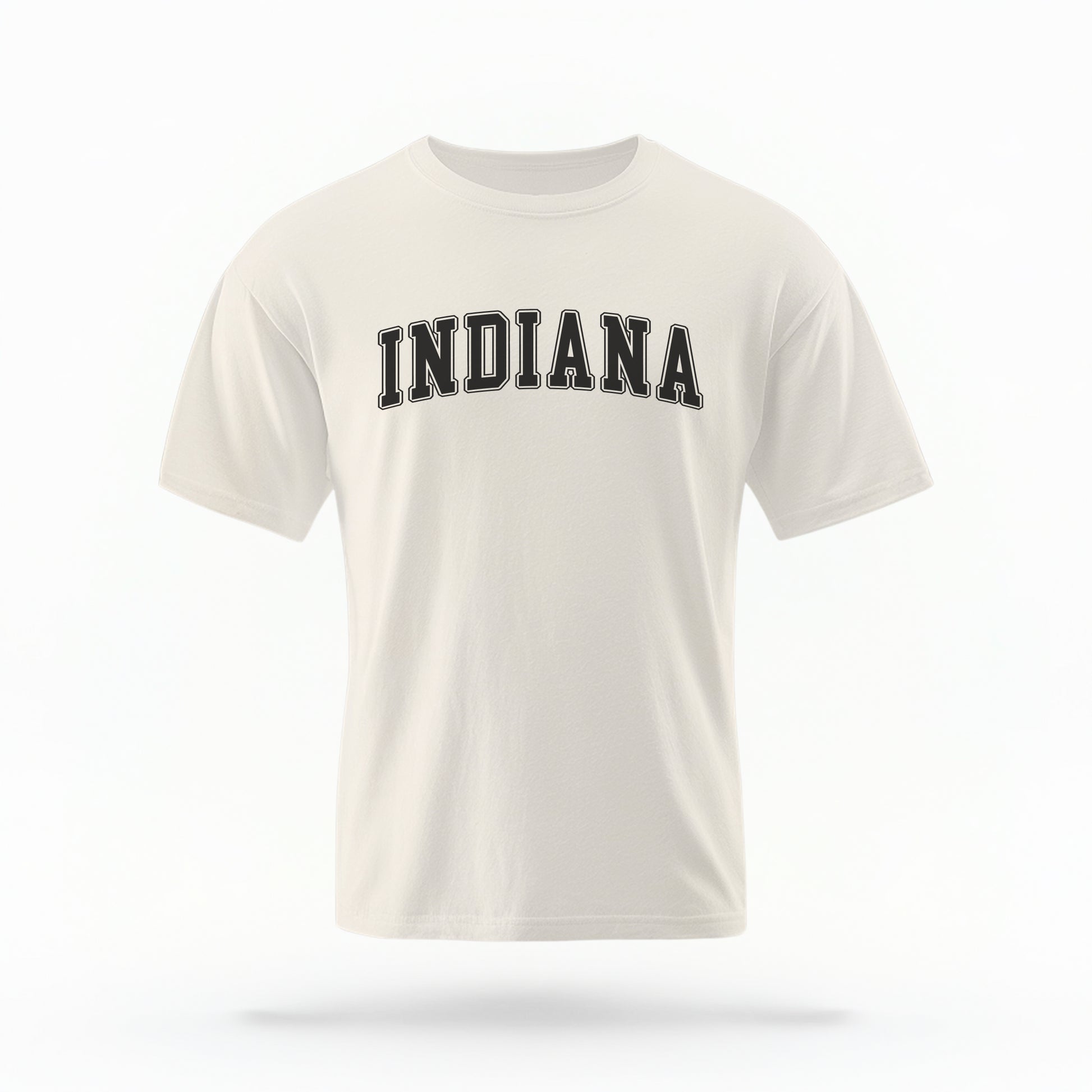 The ivory Unisex Indiana Varsity Comfort Colors T-shirt lays flat on a white background. The Indiana graphic is in bold black in a varsity offset style.