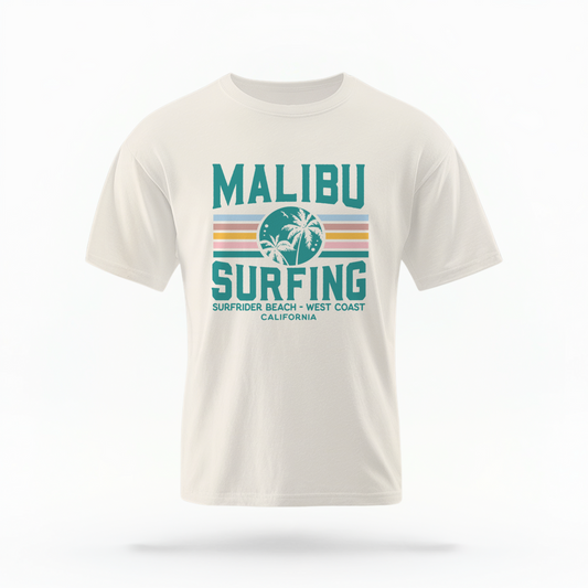 The Ivory Adult Unisex Malibu California Surfing Comfort Colors T-shirt lays flat on a white background. The ﻿Malibu California Surfing﻿ graphic is in bold Lifestyle in a Multicolor style.