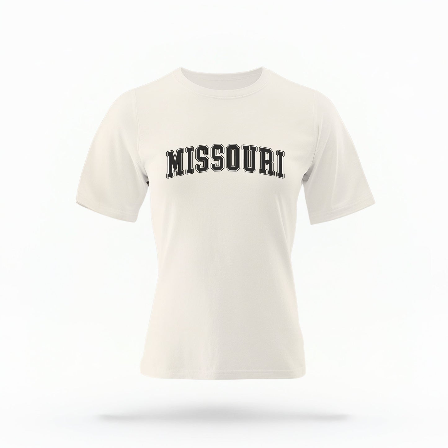 The Ivory Unisex Missouri Varsity Comfort Colors T-shirt lays flat on a white background. The Missouri graphic is in bold black in a varsity offset style.