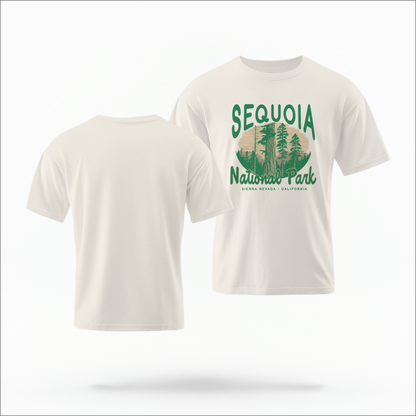 The Ivory Adult Unisex Sequoia National Park Comfort Colors T-shirt lays flat on a white background. The ﻿Sequoia National Park﻿ graphic is in bold green in a Rustic Park style.