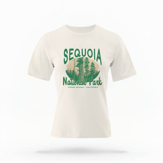 The Ivory Adult Unisex Sequoia National Park Comfort Colors T-shirt lays flat on a white background. The ﻿Sequoia National Park﻿ graphic is in bold green in a Rustic Park style.