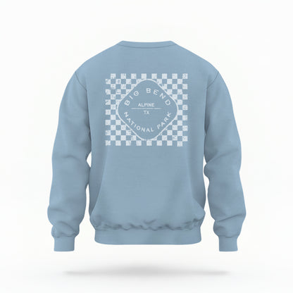 A model wears the Light Blue Big Bend Retro Typography Crewneck Sweatshirt.  The ﻿Big Bend Retro Typography﻿ graphic is in bold White in a Retro style.