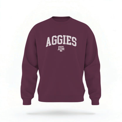 The Maroon Unisex Texas A&M Aggies Collegiate Crewneck Sweatshirt lays flat on a white background. The ﻿Texas A&M Aggies Collegiate﻿ graphic is in bold white in a Collegiate style.