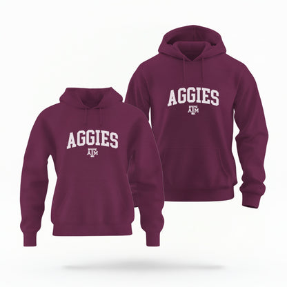 The Maroon Adult Unisex Texas A&M Aggies Collegiate Hooded Sweatshirt lays flat on a white background. The ﻿Texas A&M Aggies Collegiate﻿ graphic is in bold White in a Varsity style.