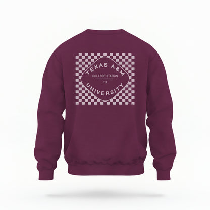 The Maroon Texas A&m Retro Typography Crewneck Sweatshirt lays flat on a white background. The ﻿Texas A&m Retro Typography﻿ graphic is in bold White in a Retro style.