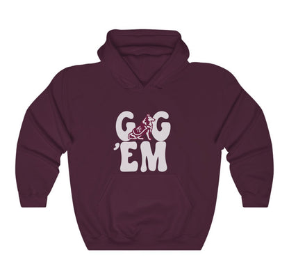 The Maroon Adult Unisex Texas A&M Gig 'Em Retro Reveille Hooded Sweatshirt lays flat on a white background. The ﻿Texas A&M Gig 'Em Retro Reveille﻿ graphic is in bold White in a Groovy Vintage style.