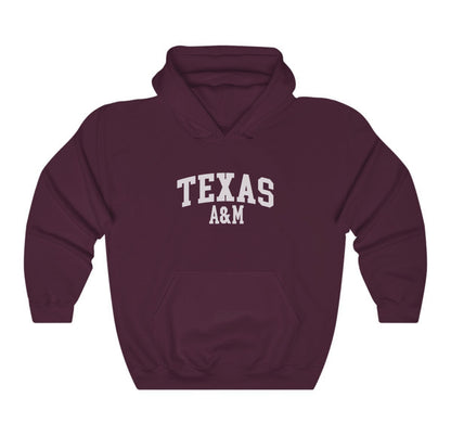 The Maroon Adult Unisex Texas A&M Varsity Hooded Sweatshirt lays flat on a white background. The ﻿Texas A&M Varsity﻿ graphic is in bold White in a Collegiate style.