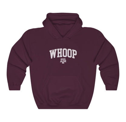 The Maroon Adult Unisex Texas A&M Whoop Collegiate Hooded Sweatshirt lays flat on a white background. The ﻿Texas A&M Whoop Collegiate﻿ graphic is in bold White in a Varsity style.