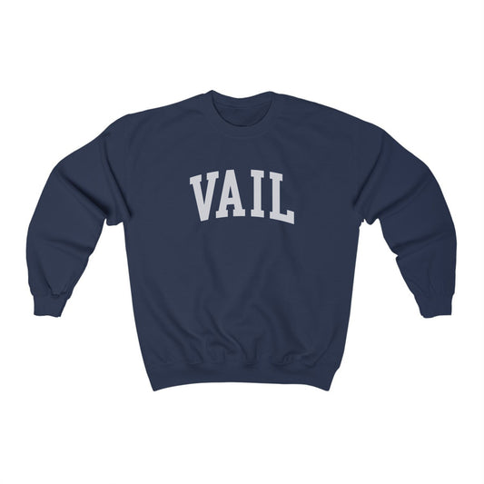 The Navy Vail Colorado Varsity Crewneck Sweatshirt lays flat on a white background. The ﻿Vail Colorado Varsity﻿ graphic is in bold White in a Collegiate style.