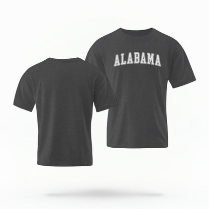 The Pepper Unisex Alabama Varsity Comfort Colors T-shirt lays flat on a white background. The Alabama graphic is in bold white in a varsity offset style.