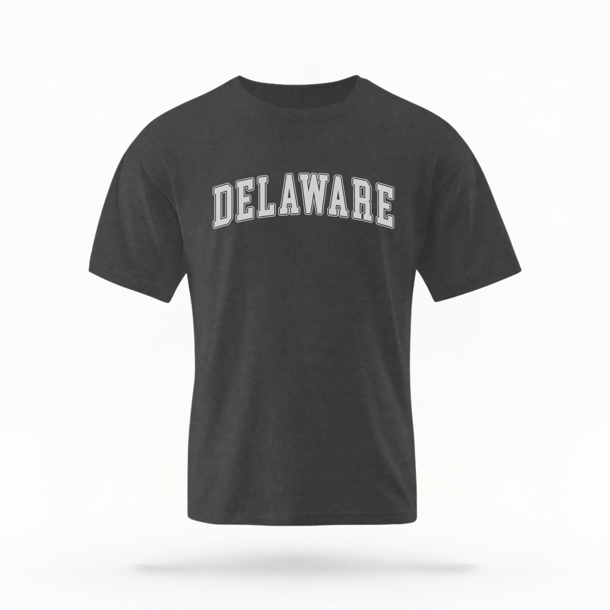 The Pepper Unisex Delaware Varsity Comfort Colors T-shirt lays flat on a white background. The Delaware graphic is in bold white in a varsity offset style.