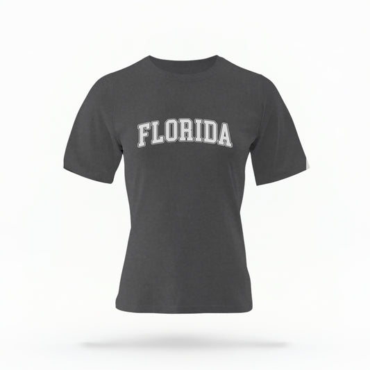 The pepper Adult Unisex Florida Varsity Comfort Colors T-shirt lays flat on a white background. The Florida graphic is in bold white in a varsity offset style.