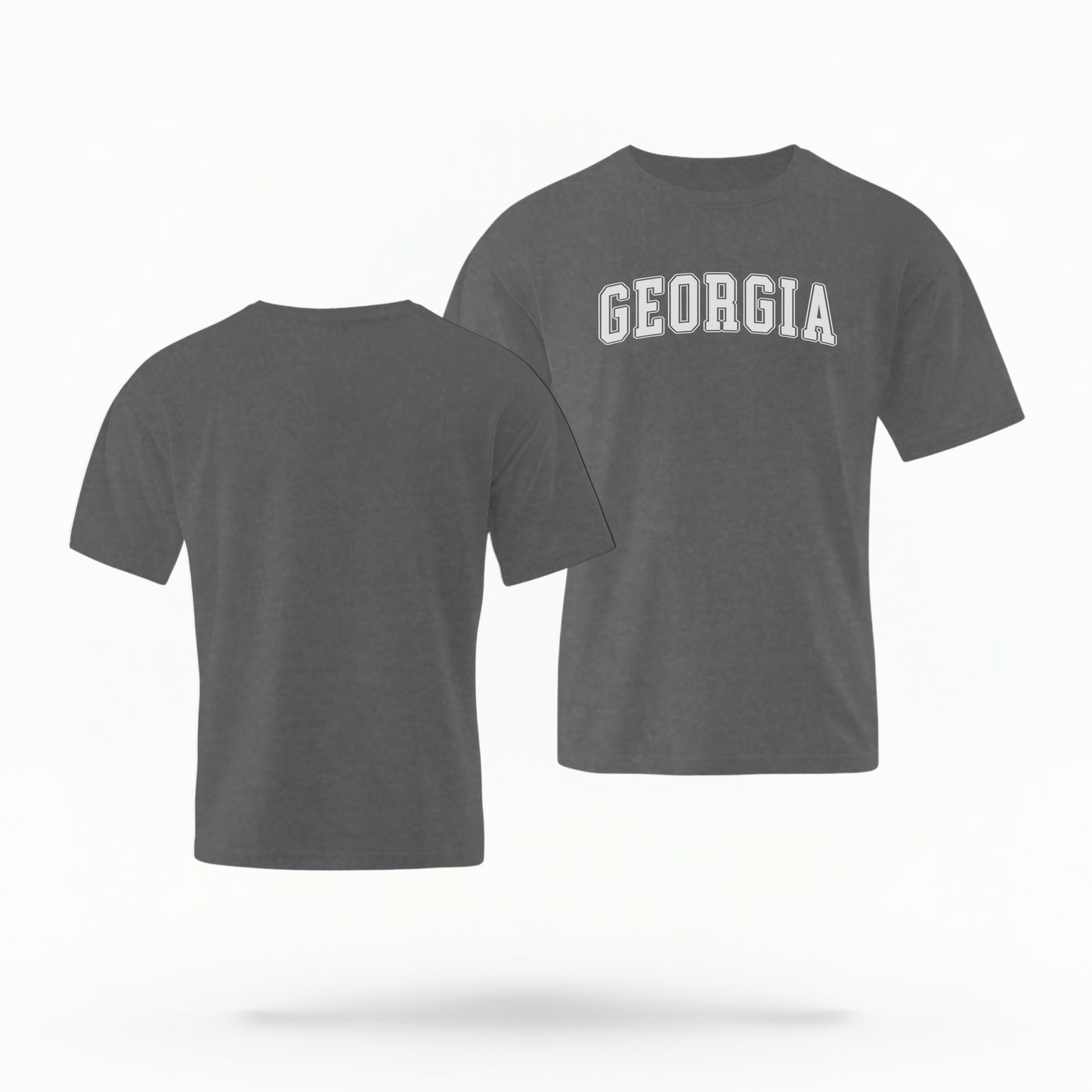 The Pepper Unisex Georgia Varsity Comfort Colors T-shirt lays flat on a white background. The Georgia graphic is in bold white in a varsity offset style.
