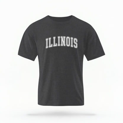 The Pepper Unisex Illinois Varsity Comfort Colors T-shirt lays flat on a white background. The Illinois graphic is in bold white in a varsity offset style.
