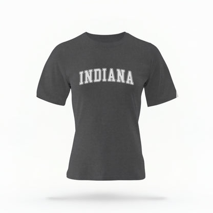 The Pepper Unisex Indiana Varsity Comfort Colors T-shirt lays flat on a white background. The Indiana graphic is in bold white in a varsity offset style.