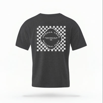 The Pepper Joshua Tree Retro Checkered Comfort Colors T-shirt lays flat on a white background. The ﻿Joshua Tree Retro Checkered﻿ graphic is in bold White in a Retro style.