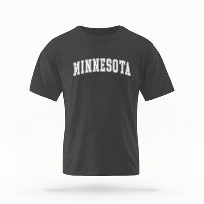 The Pepper Unisex Minnesota Varsity Comfort Colors T-shirt lays flat on a white background. The Minnesota graphic is in bold white in a varsity offset style.
