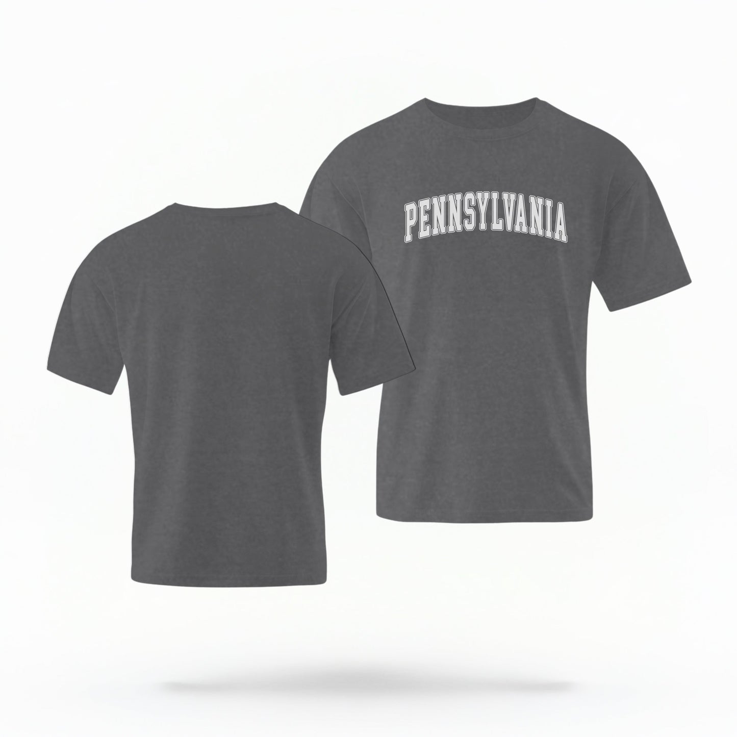 The Pepper Unisex Pennsylvania Varsity Comfort Colors T-shirt lays flat on a white background. The Pennsylvania graphic is in bold white in a varsity offset style.