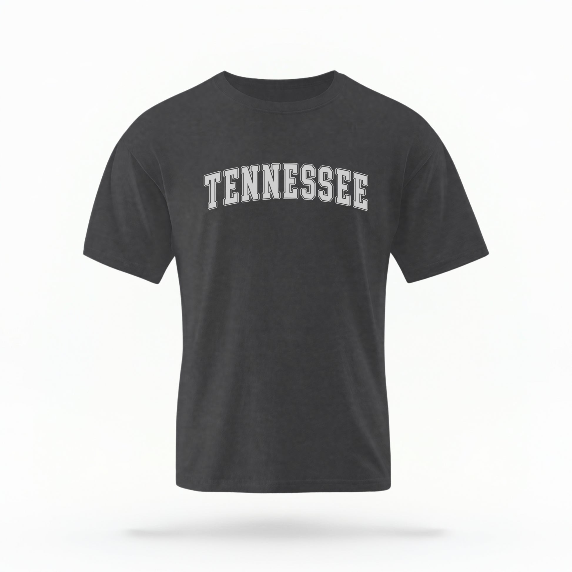 The Pepper Unisex Tennessee Varsity Comfort Colors T-shirt lays flat on a white background. The Tennessee graphic is in bold white in a varsity offset style.