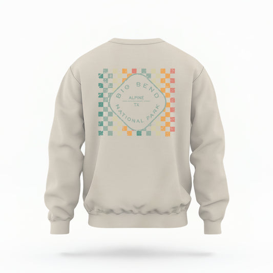 A model wears the Sand Big Bend Retro Typography Crewneck Sweatshirt.  The ﻿Big Bend Retro Typography﻿ graphic is in bold Multicolor in a Retro style.