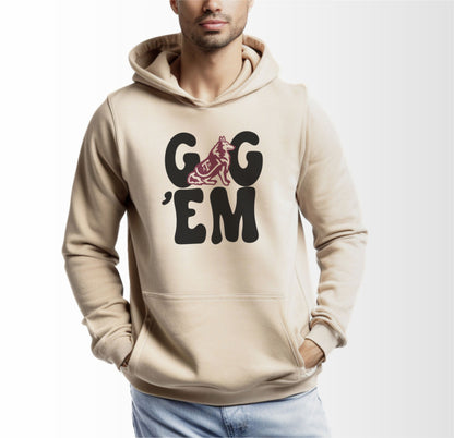 A model wears the Sand Adult Unisex Texas A&M Gig 'Em Retro Reveille Hooded Sweatshirt.  The ﻿Texas A&M Gig 'Em Retro Reveille﻿ graphic is in bold Black in a Groovy Vintage style.