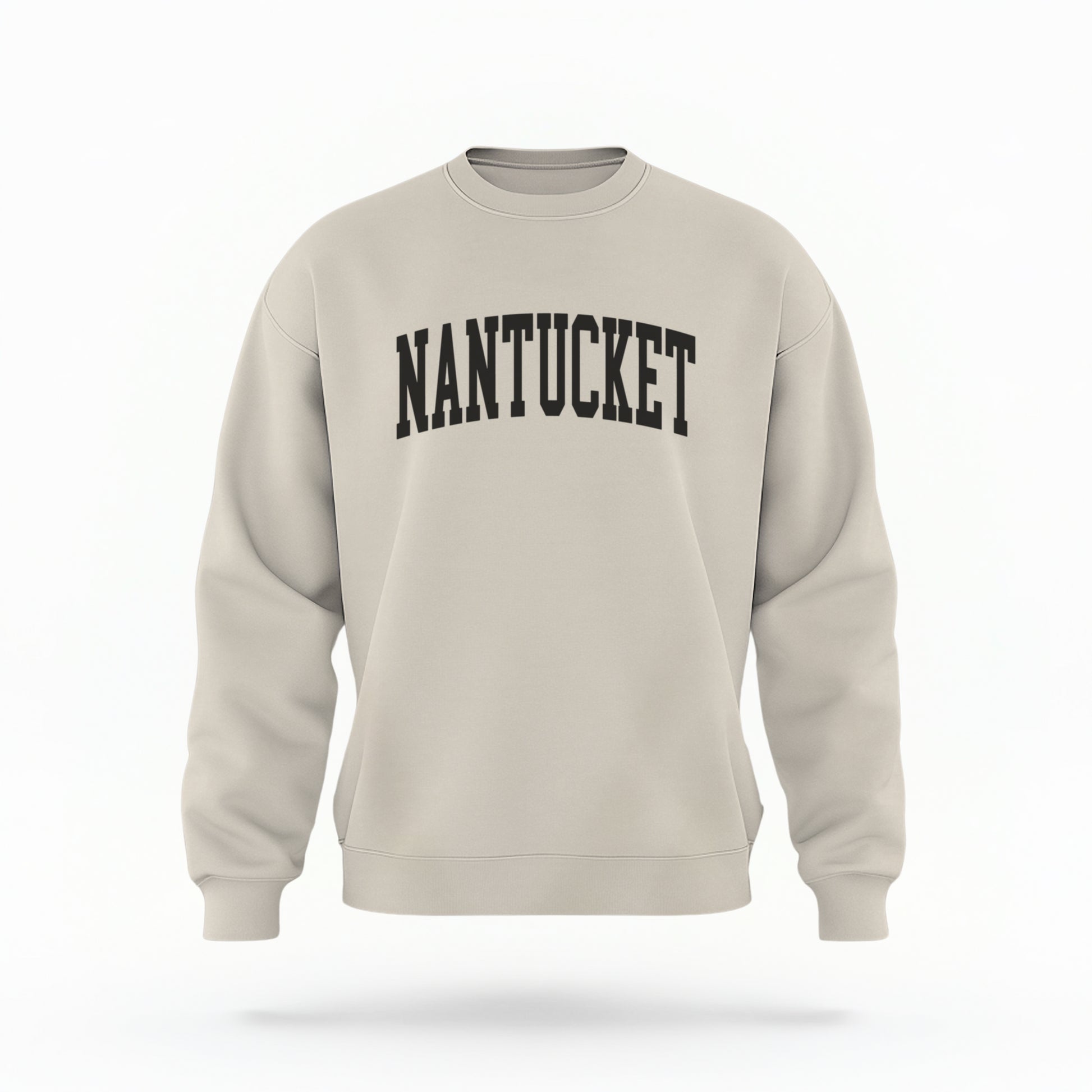 The Sand Unisex Nantucket Varsity Crewneck Sweatshirt lays flat on a white background. The Nantucket graphic is in bold black and varsity offset style.