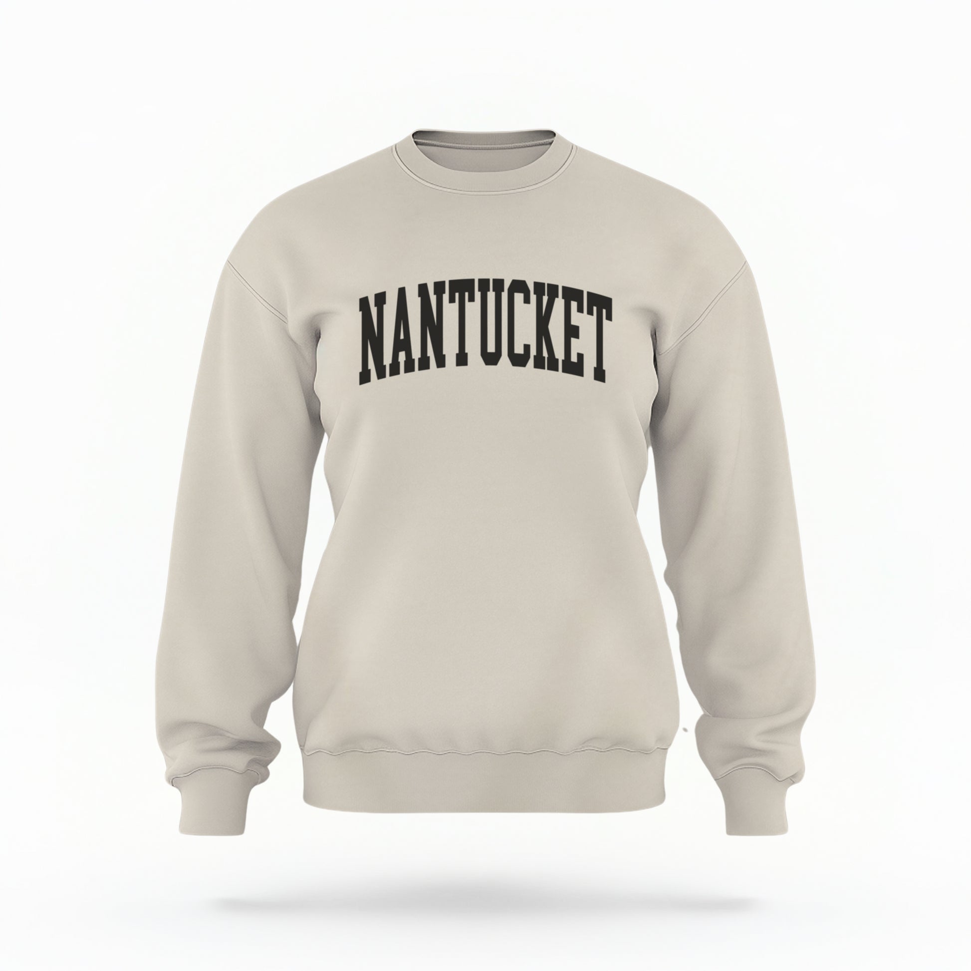 The Sand Unisex Nantucket Varsity Crewneck Sweatshirt lays flat on a white background. The Nantucket graphic is in bold black and varsity offset style.