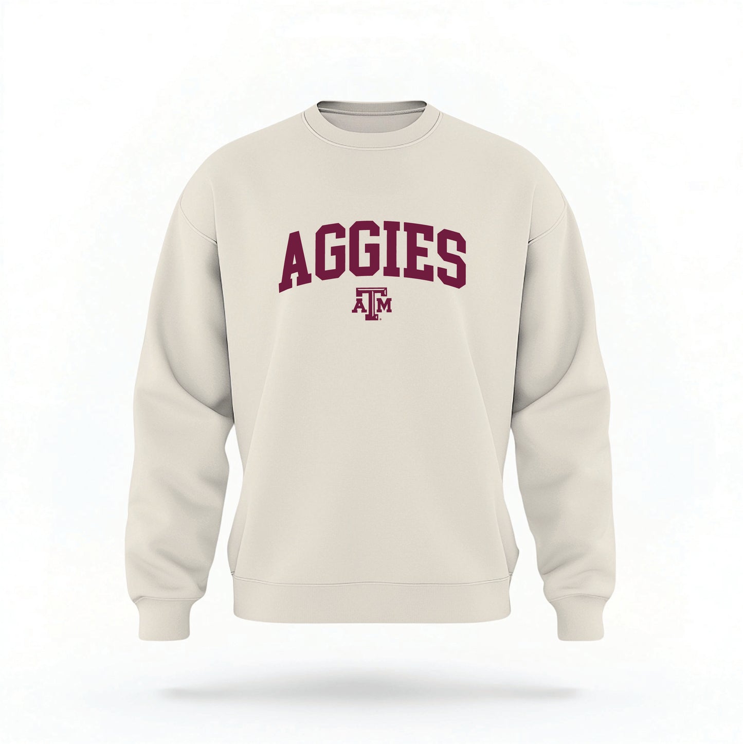 The Sand Unisex Texas A&M Aggies Collegiate Crewneck Sweatshirt lays flat on a white background. The ﻿Texas A&M Aggies Collegiate﻿ graphic is in bold maroon in a Collegiate style.