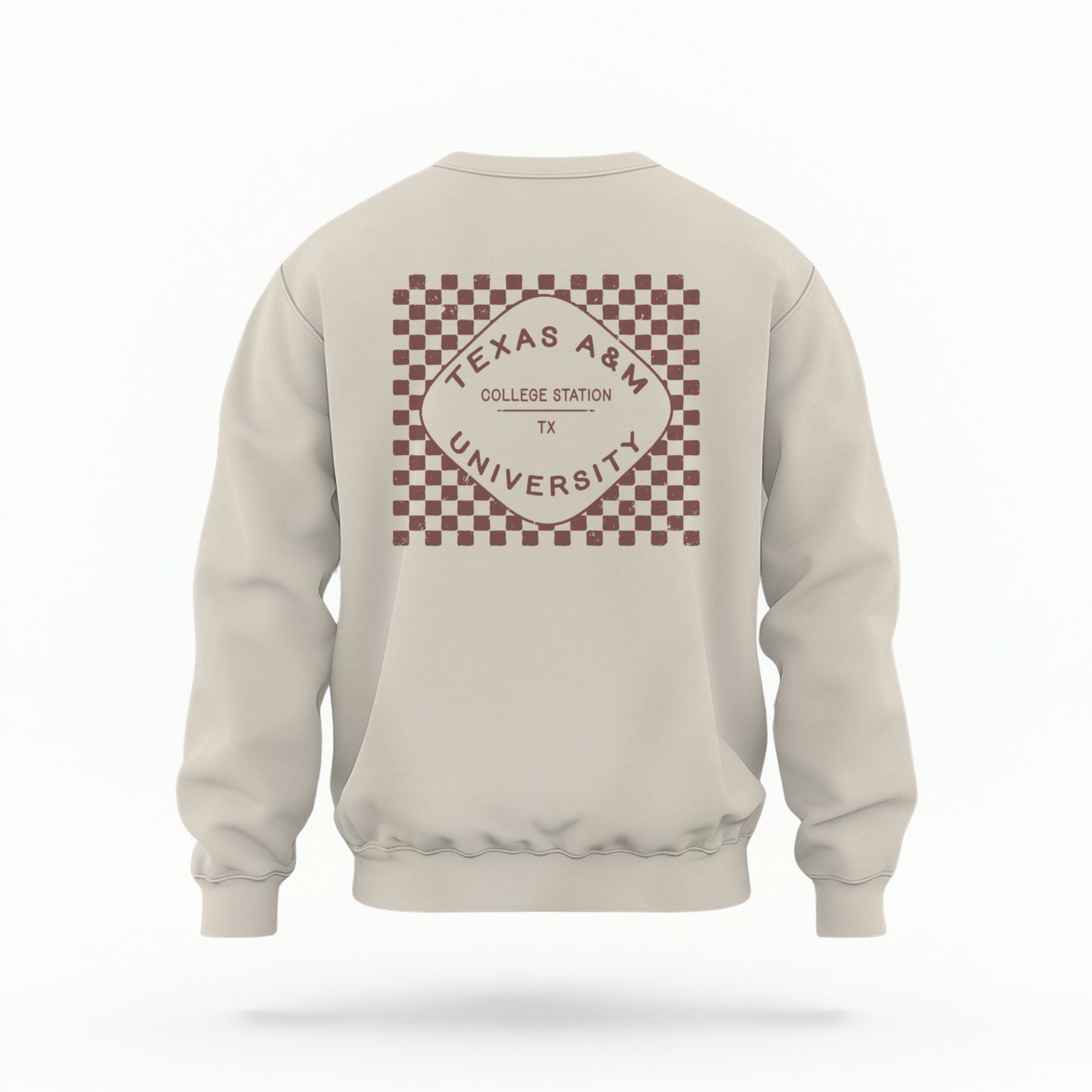 The Sand Texas A&m Retro Typography Crewneck Sweatshirt lays flat on a white background. The ﻿Texas A&m Retro Typography﻿ graphic is in bold Maroon in a Retro style.