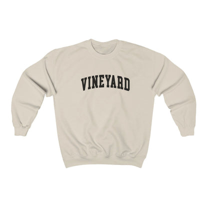 The Sand Adult Unisex Martha's Vineyard Massachusetts Classic Crewneck Sweatshirt lays flat on a white background. The ﻿Martha's Vineyard Massachusetts Classic﻿ graphic is in bold Black in a Varsity style.