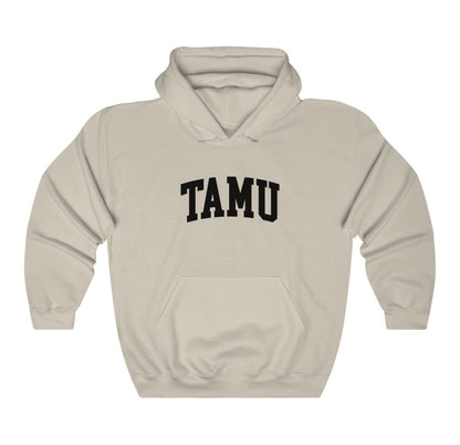 The Sand Adult Unisex Texas A&M TAMU Hooded Sweatshirt lays flat on a white background. The ﻿Texas A&M TAMU﻿ graphic is in bold Black in a Collegiate style.