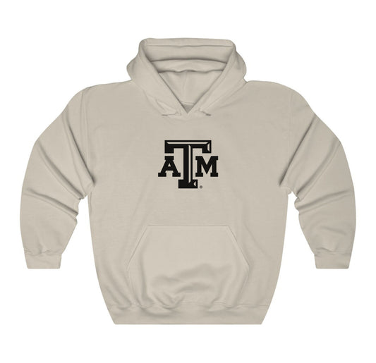 The Sand Adult Unisex Texas A&M Logo Hooded Sweatshirt lays flat on a white background. The ﻿Texas A&M Logo﻿ graphic is in bold Black in a Varsity style.