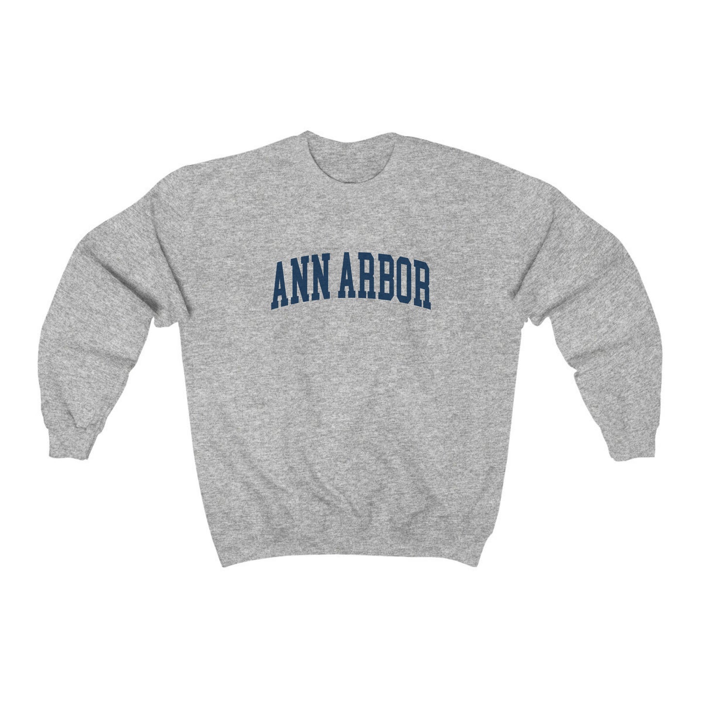 The Sport Grey Adult Unisex Ann Arbor Michigan Varsity Crewneck Sweatshirt lays flat on a white background. The Ann Arbor Michigan Varsity graphic is in bold Navy in a Collegiate style.