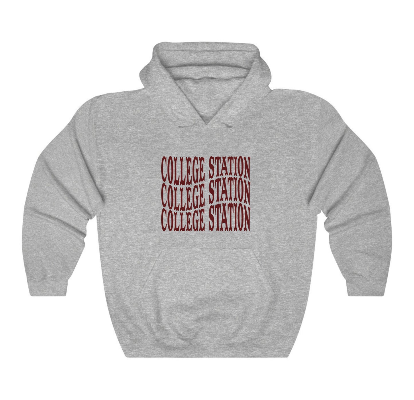 The Sport Grey Adult Unisex College Station Western Hooded Sweatshirt lays flat on a white background. The ﻿College Station Western﻿ graphic is in bold Maroon in a Western style.