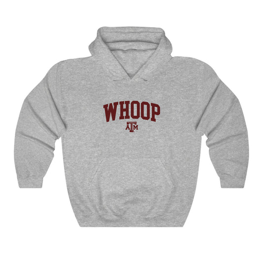 The Sport Grey Adult Unisex Texas A&M Whoop Collegiate Hooded Sweatshirt lays flat on a white background. The ﻿Texas A&M Whoop Collegiate﻿ graphic is in bold Maroon in a Varsity style.